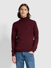 Gosforth Merino Wool Roll Neck Sweater In Farah Red