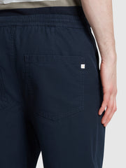 Hawtin Tapered Fit Canvas Drawstring Trousers In True Navy
